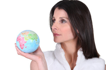 woman holding a globe