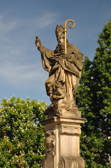 Obraz premium Saint Augustine statue holding, Charles Bridge Prague