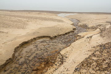 Water creek in sand