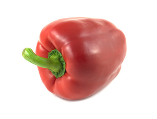 Big red bell pepper isolated on white closeup