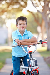 Obraz premium Boy Riding Bike On Path