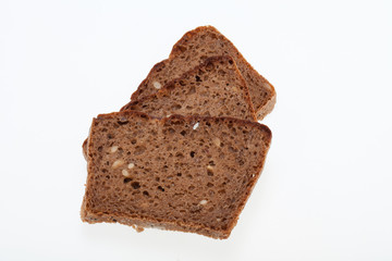 Slices of dark bread isolated over white