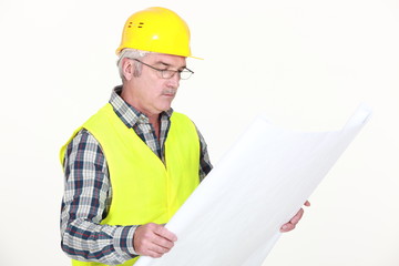 Foreman looking at plans