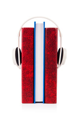 Concept of audio books with earphones on white