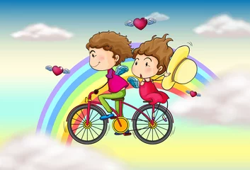  Liefhebbers rijden op een fiets in de buurt van de regenboog © GraphicsRF