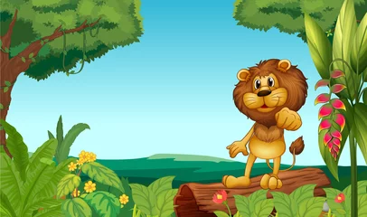 Gordijnen Een leeuw boven een stam in de jungle © GraphicsRF