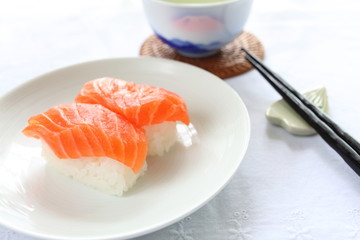 Japanese cuisine, salmon sushi with green tea