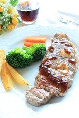 Beef steak with side dish fried potato and vegetable