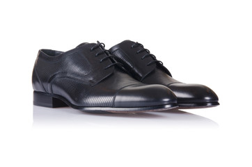 Fashion concept with male shoes on white