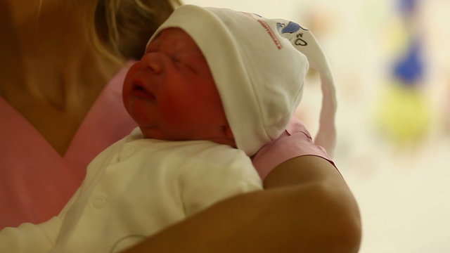 newborn in hospital room