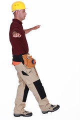 Builder balancing on one leg