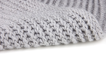 Knitted scarf texture over white with space for text