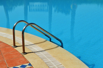 Swimming pool in touristic resort during summer time