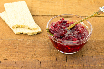 Cranberry jam on a wooden board