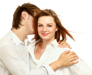 Portrait of happy young couple in white