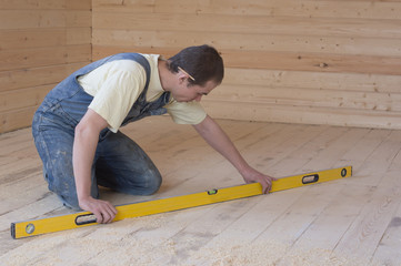 Worker with level.