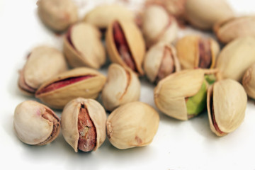 pistachios nuts on a light background