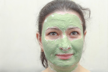 woman with green mask on face healthy treatment