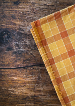 Tablecloth on wooden table background
