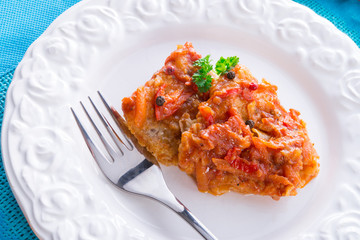 fish in Greek kind with vegetables and tomato sauce