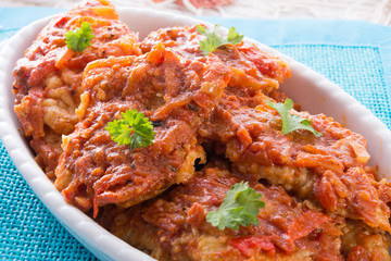 fish in Greek kind with vegetables and tomato sauce