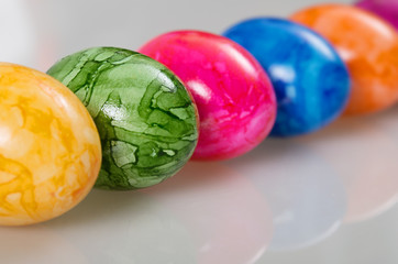 easter colored eggs on white