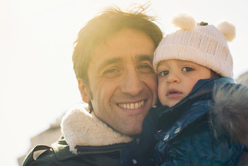 Portrait of father and young daughter outdoors In the park.  © pio3