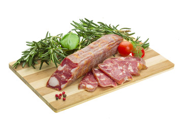 Salami with rosemary, basil and tomato