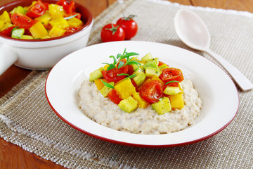 Oatmeal porridge with baked vegetables and rosemary
