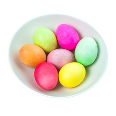 Easter eggs in a bowl on white background