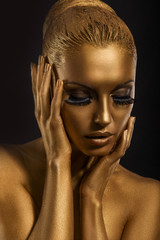 Face Art. Fantastic Gold Make Up. Stylized Colored Woman's Body