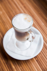 A glass of capuccino