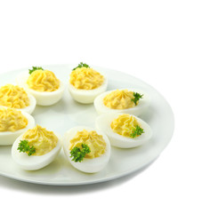 Deviled eggs with parsley in a plate