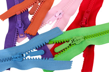 Multicolored zippers isolated on white