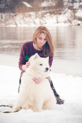 girl with samoed dog