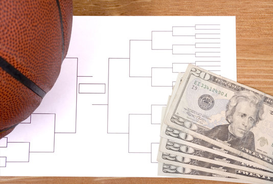 March Madness Basketball Bracket And Fanned Money