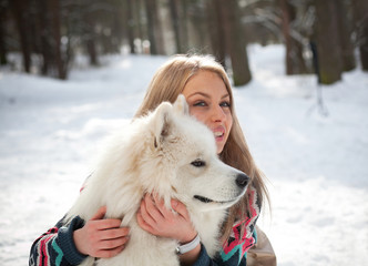 girl with samoed dog
