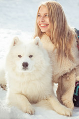 girl with samoed dog
