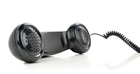 A traditional telephone handset receiver on white background