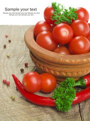 Tomato and red hot chili peppers in old mortar
