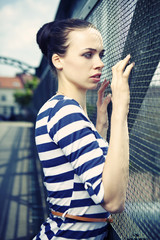 Petite young woman in stripes
