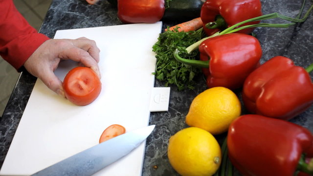 slicing tomato with a chef knife