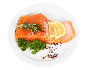 Fresh salmon fillet with herbals and lemon slices