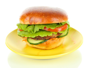 Big and tasty hamburger on plate isolated on white
