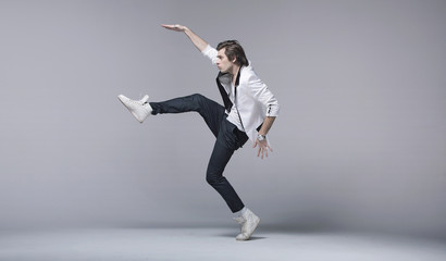 Handsome man in acrobating pose
