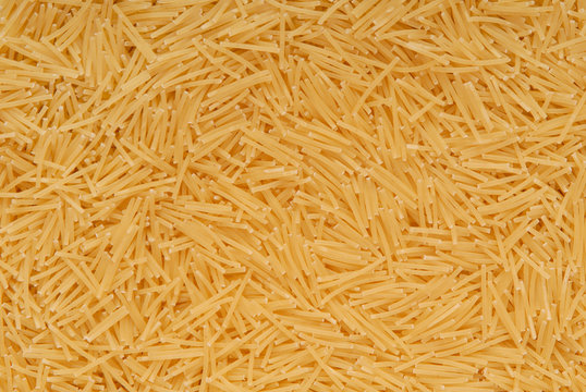 A texture background is out of yellow vermicelli.