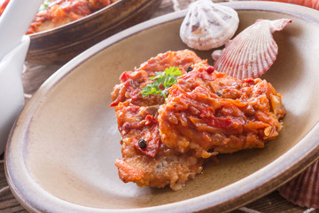 fish in Greek kind with vegetables and tomato sauce