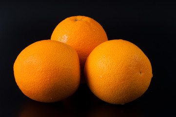 Ripe orange isolated on black background