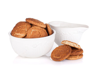 Bowl with cookies and milk