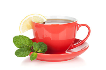 Red tea cup with lemon and mint